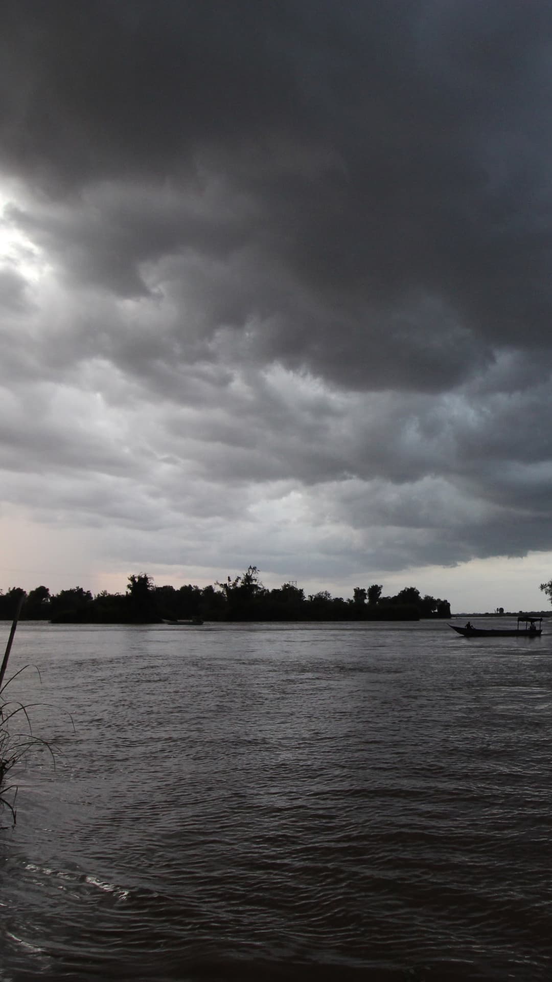 Heavy storm clouds over a river